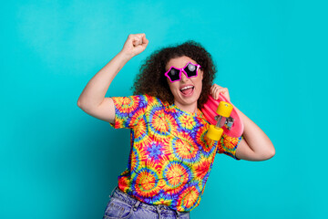 Photo of positive lovely glad woman wear stylish print clothes have fun good mood isolated on cyan color background