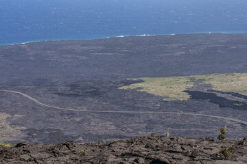 Mauna Ulu lava flows 1969 to 1974, Hawaii Volcanoes National Park, The Hilina Pali (cliff) on...