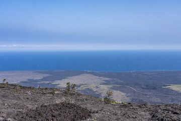 Mauna Ulu lava flows 1969 to 1974, Hawaii Volcanoes National Park, The Hilina Pali (cliff) on...