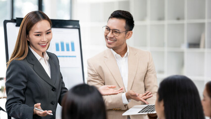 Image of business partners discussing documents and ideas at meeting