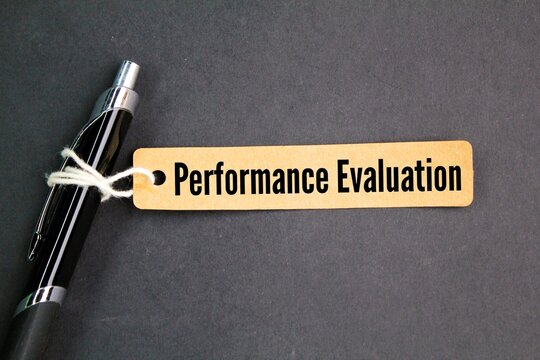 pen and paper tag with the word performance evaluation. the concept of performance evaluation every year