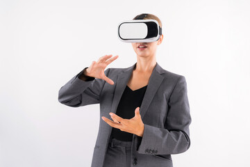 Business woman holding something while wearing VR goggle and standing at white background. Project manager with headset enter visual reality world program by using technology innovation. Contraption.