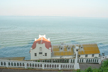 Bay in Alcatraz Island with an old coast house with a yellow ceiling