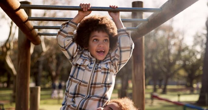 Mother, child and playing with monkey bars at park for fun bonding, outdoor holiday or weekend in nature. Happy little boy or kid with parent in joy or happiness for hanging in playground at forest