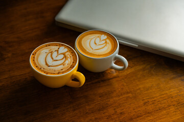 A beautiful latte in a cozy coffee shop, select focus.