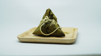 Traditional wrapped rice dumpling or zongzi on a plate