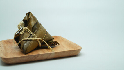 Traditional wrapped rice dumpling or zongzi on a plate