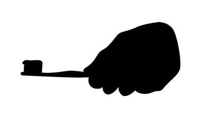 silhouette of hand holding toothbrush