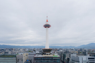 Obraz premium Kyoto, Japan - April 2023: Kyoto Tower completed in 1964 it's the tallest structure in Kyoto stands atop a 9-story building, located opposite side of Kyoto Station.