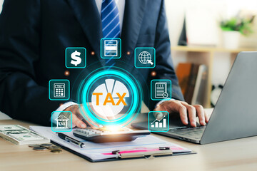 Calculation tax return concept. Businessman is working on his taxes, using a calculator and laptop. Individual income tax return form online. Government, state taxes. Financial research. Calculating.
