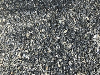 Black small road stone background, dark gravel pebbles stone texture seamless texture, granite,marble
