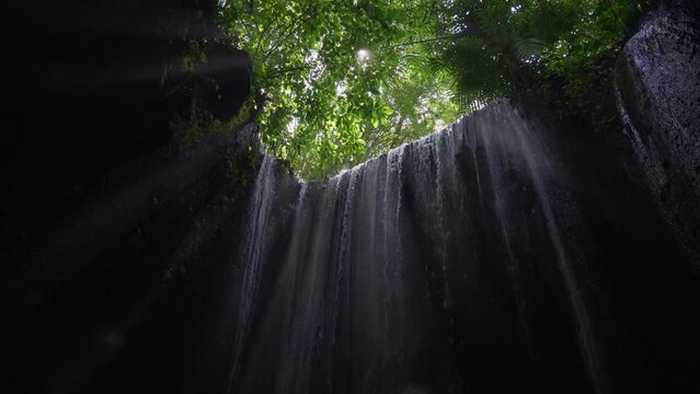 waterfall inside cave at Tukad Cepung slow motion
