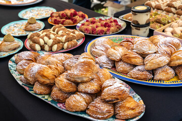 Sfogliatella pastries, traditional Italian dessert with flaky layers, powdered sugar on top. Freshly baked Sfogliatella