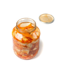 Kimchee in a glass jar isolated. Spicy kim chi, hot fermented napa cabbage, jimchi, korean gimchi