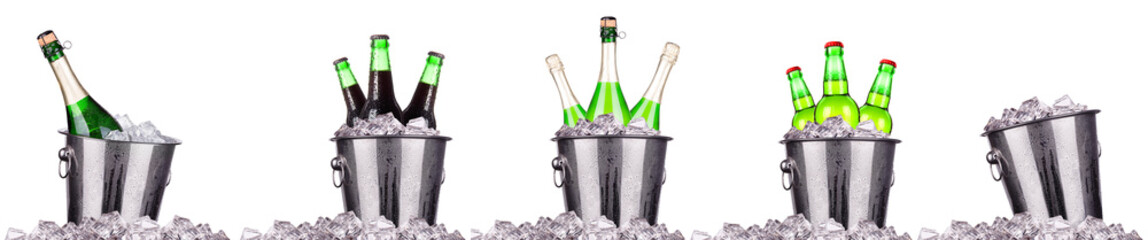 Champagne and beer bottle in a bucket with ice isolated on the white © boule1301