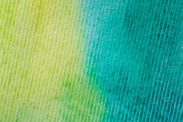 striped watercolor paper painted with yellow and turquoise paint
