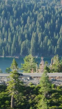 Vertical Screen: Experience the aweinspiring beauty of Tahoe Lake, California on vertical screen, offering breathtaking views of forests and mountains. Ideal for nature lovers and outdoor enthusiasts