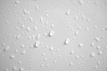 Water drops on white wall background texture