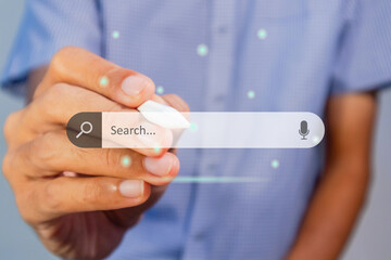 Man searching for information using internet on virtual screen. Search engine optimization concept.