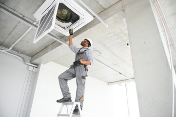 AC Electrician Technician Repairing Air Conditioner Appliance