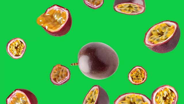 Exotic Cascade: Juicy Halved, half Passion Fruits in Motion, Falling Down from Above on a green box screen Background, 4K Passion Fruits Video 