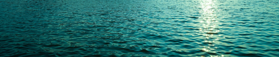 sea water surface background with sunset 