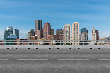 Empty urban asphalt road exterior with city buildings background. New modern highway concrete construction. Concept of way to success. Transportation logistic industry fast delivery. Boston. USA.