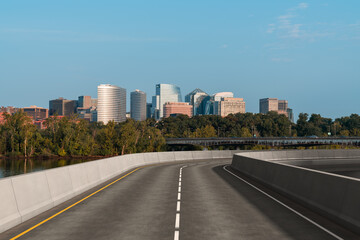 Obraz premium Empty urban asphalt road exterior with city buildings background. New modern highway concrete construction. Concept way to success. Transportation logistic industry fast delivery. Arlington. USA.