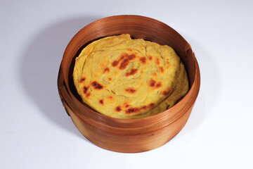 Typical Indian roti canai served on a bamboo basket