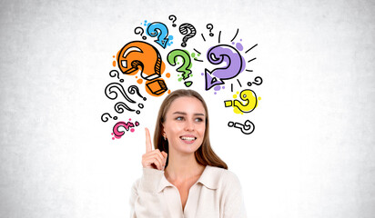 A woman with an inspired expression points upward, surrounded by