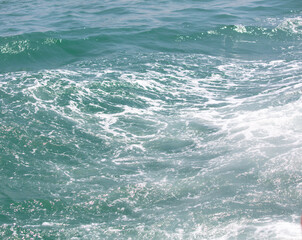 Fototapeta premium Waves in the sea abstract background. Texture