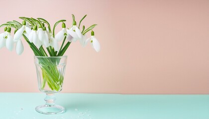 Spring Elegance: Pastel Space Bouquet with Snowdrops in a Glass Goblet"
