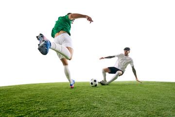 Two soccer players, one in white and one in green, fiercely compete for ball on green lash playground against white background. Concept of professional sport, championship, final match, movement. Ad