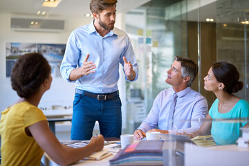 Obraz premium People, business meeting and accountants in conference room for budget plan and finance report. Corporate group, speaker and accounting faq in office for collaboration, discussion and communication