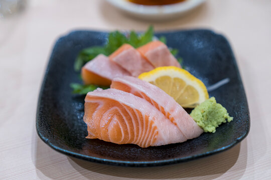 Japan raw salmon slice or salmon sashimi in japanese style. Salmon sasimi on disc.