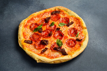 Delicious pepperoni pizza with salami. Traditional pizza. Italian cuisine.