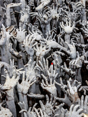 Hands of Hell from the White Temple of Chiang Rai, the hands coming out of the ground represent the souls of hell trying to escape from it.