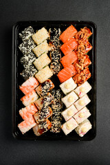 Japanese food. Set of sushi rolls with caviar, fish and shrimp. Food delivery. Free space for text.