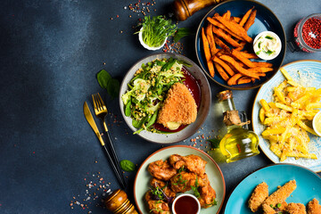 Set of food and dishes and snacks on stone table. Restaurant dishes. Menu mockup. Top view.