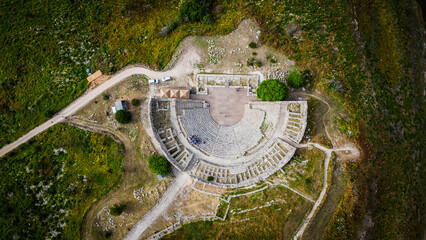 Aerial view of Archaeological Park of Segesta ruins in Sicily , temple and theatre top down 
