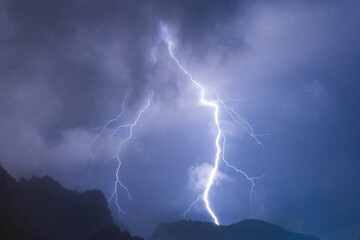 Dramatic lightning strike during a thunderstorm in the mountains of Vietnam