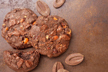 double chocolate cookies on rusty background.