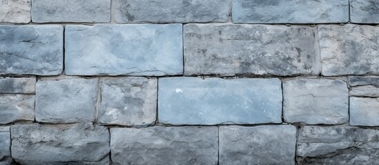 Fototapeta premium Stone pattern and textures make up the background of this horizontal photo featuring a grey blue shutter door The image includes various textures and backgrounds. Creative banner. Copyspace image