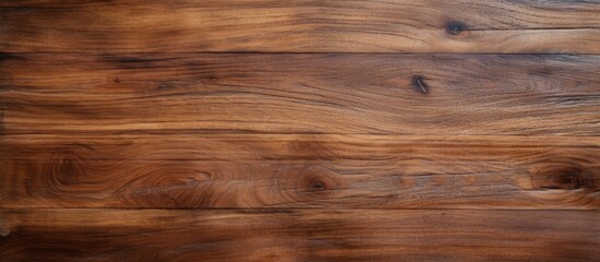 Fototapeta premium The top view of a teak wood table panel features a detailed and weathered wooden surface providing a rich and textured background The copy space image showcases the characteristics of the aged brown
