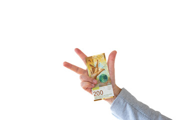 One 200 Swiss francs cash banknote or bill held by Caucasian mal