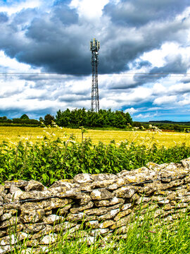 Tall mast over field in Levisham north Yorkshire. Connection 3g 4g 5g dramtic