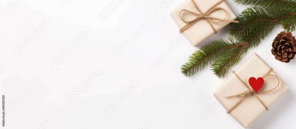 Aufkleber top view of a christmas themed flat lay with the word love and a small gift box surrounded by spruce