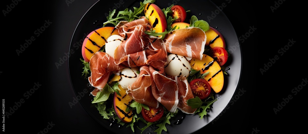 Aufkleber close up top view of a fresh gourmet salad on a white plate against a black background featuring gri