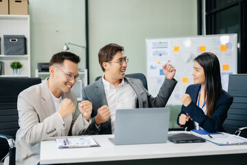  Young Asian business team creative businesspeople coworker, teamwork celebrating achievement and in planning