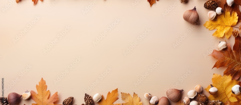 Aufkleber Fall themed flat lay composition with a border of dried oak leaves and acorns on an autumn background Ideal for Thanksgiving day or seasonal concepts with ample copy space for additional design eleme